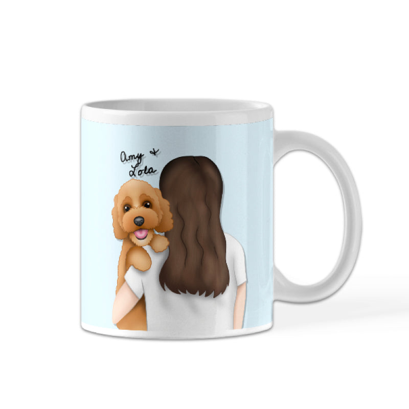 A white porcelain mug with an illustration of a person hugging a brown dog, and the text 'Mama's Boy' on it.