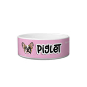 Pink pet bowl with a dog illustration and 'Piglet' text on a white background