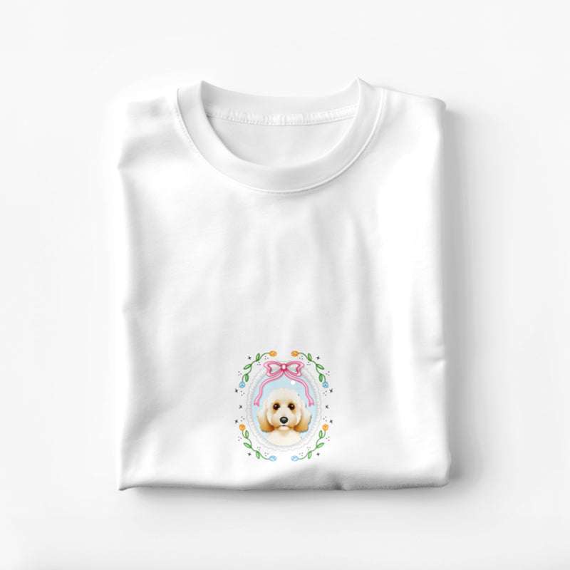 A white crew neck t-shirt with a custom hand-drawn illustration of a pet in the center, framed by a floral wreath with a bow.