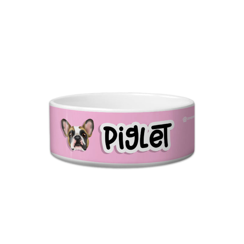 Pink pet bowl with a dog illustration and 'Piglet' text on a white background
